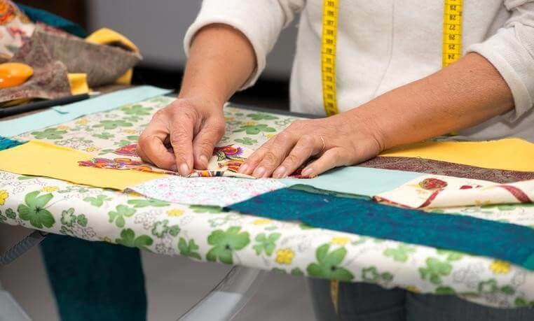 woman's hands sewing